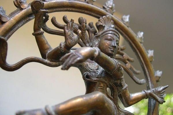 What does the statue of dancing Nataraja symbolise in the premises
