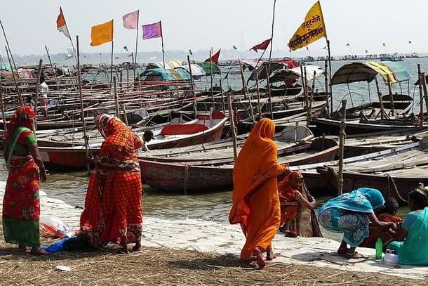 Women on Yamuna riverbank at Magh Mela festival sangam site in Allahabad. 