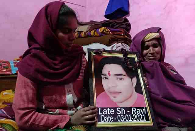 Ravi’s sister Khushboo and mother Veermati with Ravi’s picture