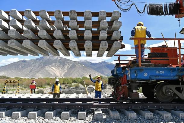 Workers deliver new railroad ties for Sichuan-Tibet railway in Dranang, the Tibet autonomous region, in June. (Xinhua)  