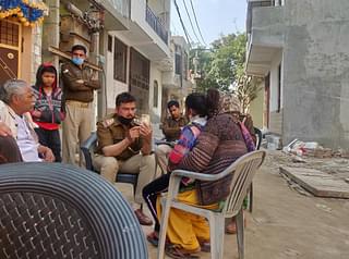 A police officer recording Durga’s statement on mobile phone