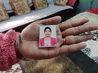 Ekta’s mother Seema shows a picture of her daughter. (Picture clicked on 16 February 2021 in Ludhiana).
