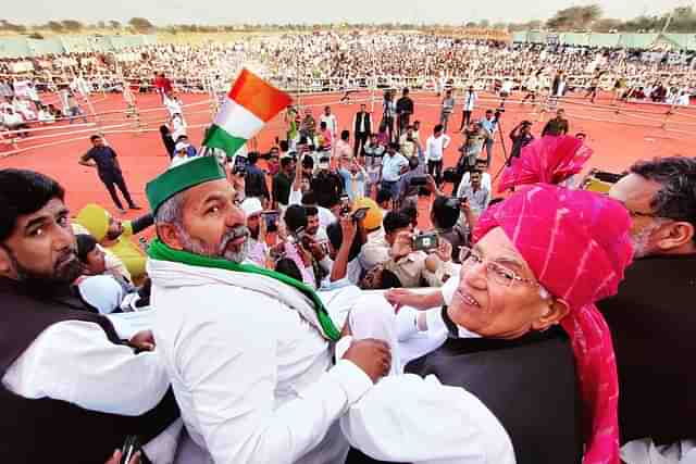 Rakesh Tikait with farmers at a protest.