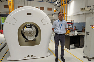 Arjun Arunachalam with his portable, lightweight, fast MRI scanner at the Voxelgrids facility in Peenya, Bengaluru