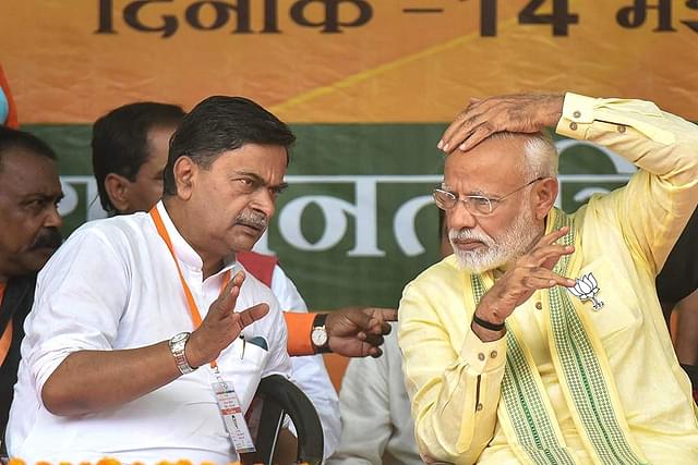 Union Minister of State (I/C) for Power R K Singh with PM Modi
(Outlook India)