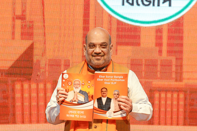 Union Home Minister Amit Shah releasing the BJP's manifesto for Bengal.