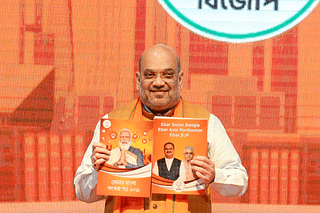 Union Home Minister Amit Shah releasing the BJP's manifesto for Bengal.