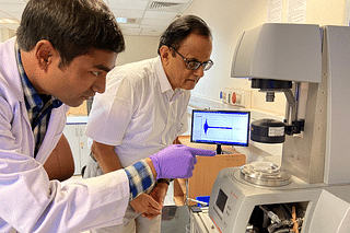 Ajay Sood with his then PhD student Pradip Bera in his lab, looking on at the Rheometre