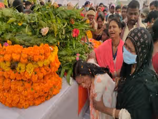 Grieving family and villagers pay last respects