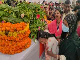 Grieving family and villagers pay last respects