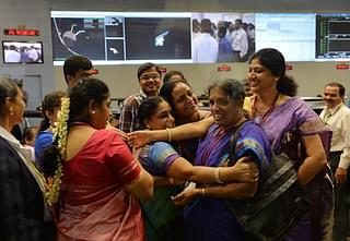 Women staff of ISRO celebrate the success of the Mangalyaan mission. (Photo: Manjunath Kiran/AFP via Getty Images)