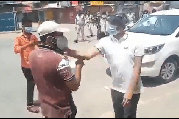 Surajpur Collector slapping youth (Pic via Screengrab)