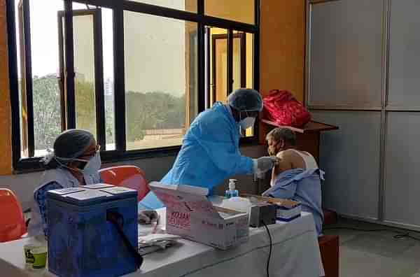 A railway employee being vaccinated in Delhi. 