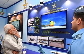 Prime Minister Narendra Modi watching a video of a BrahMos missile impact.