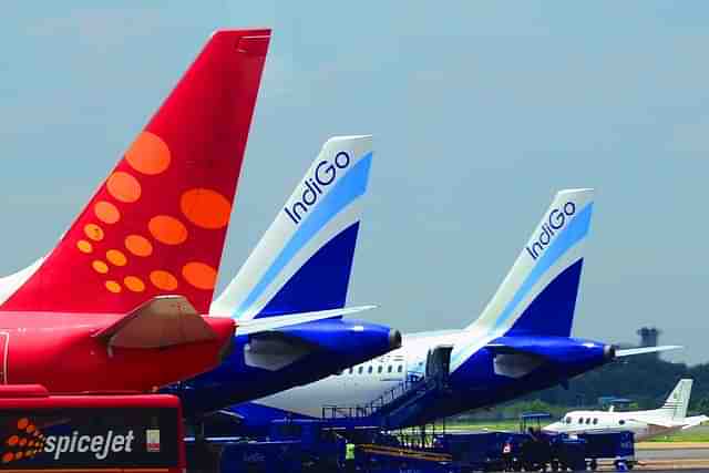 SpiceJet and IndiGo planes parked at the Indira Gandhi International  airport. (Ramesh Pathania/Mint via Getty Images)