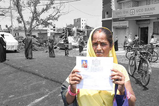 A woman showing her bank pass book. 