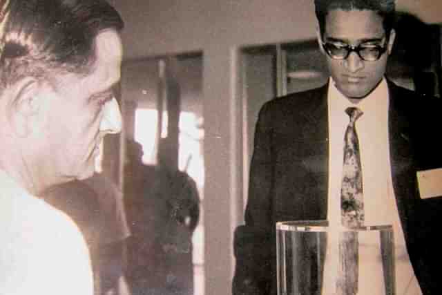 Dr Vikram Sarabhai (left) and R Aravamudan (right) looking at a piece of the Moon brought back by Neil Armstrong. (Photo: Gita Aravamudan/Twitter)