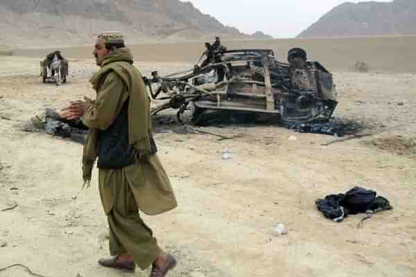 Afghans stand at the site of a blast 
 in Kandahar province, Afghanistan (Photo by Getty Images) - Representative Image