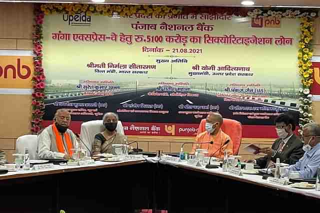 Union Finance Minister Nirmala Sitharaman and UP CM Yogi Adityanath at the event to mark handing over of Loan Sanction Letter of Rs 5100 cr for implementation of Ganga Expressway (@nsitharamanoffc/Twitter)