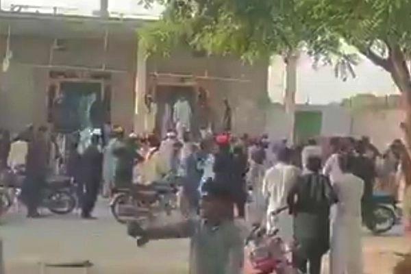 Mob attacking the temple (Pic Via Twitter)