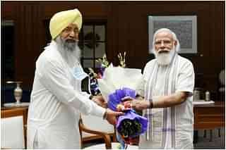Iqbal Singh Lalpura (L) with Prime Minister Narendra Modi (Facebook) 