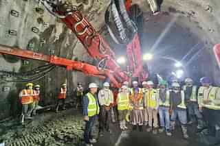 Officials inspecting tunnel work 