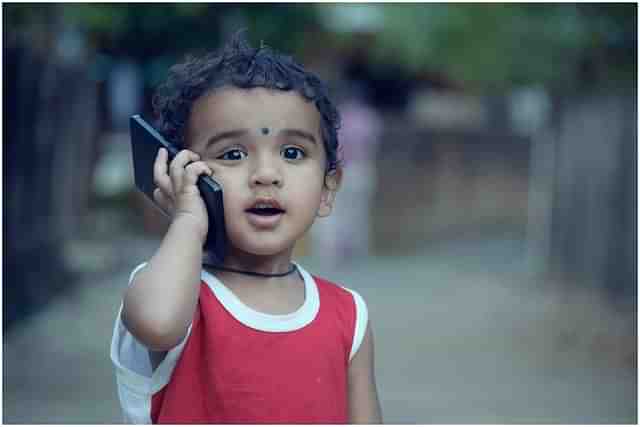 A child speaking on a mobile phone. (Pixabay)