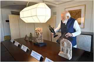 PM Modi taking a look at ancient Indian artefacts housed in the US