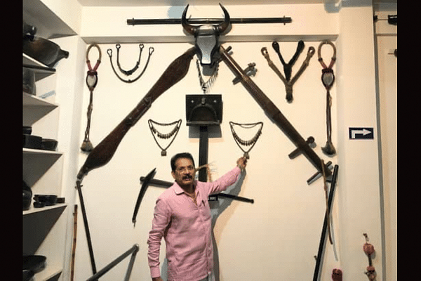 Prof Tukaram Poojary with the traditional Kambala equipment and jewels worn by buffaloes