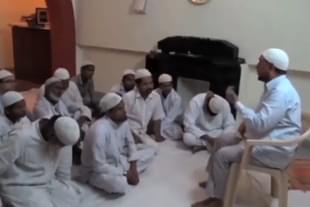 A still from the video. The one sitting on chair is alleged to be Iftikharuddin