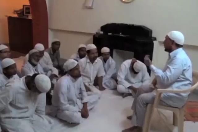 A still from the video. The one sitting on chair is alleged to be Iftikharuddin 