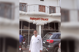 Mahant Ram Bhadra Das  outside his hotel Hanumant Palace near the railway station at Ayodhya