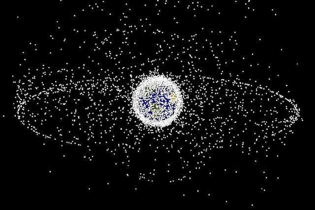 A swarm of satellites and debris around Earth