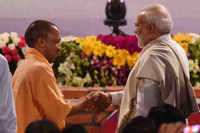 PM Narendra Modi and UP CM Yogi Adityanath  in Lucknow. (Subhankar Chakraborty/Hindustan Times via GettyImages) 