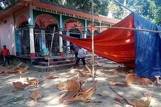 Bangladesh residents stand near a vandalised Hindu temple in Brahmanbaria. (STR/AFP/Getty Images)