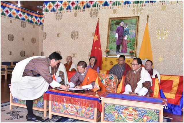 Bhutanese officials signing the agreement (Twitter)