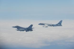Taiwan’s F-16 fighter (left) flies alongside China’s H-6 bomber