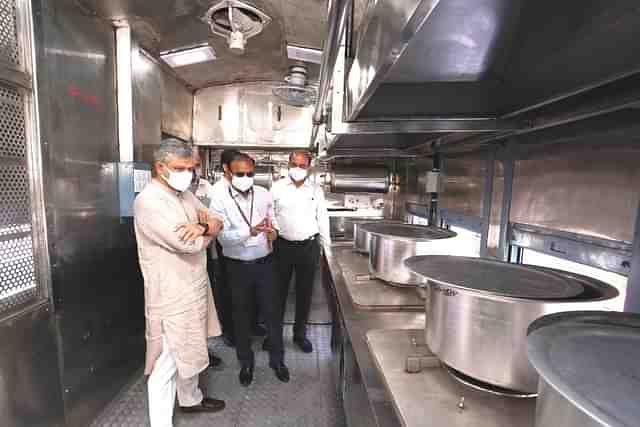 Railway Minister Ashwini Vaishnaw inspects the prototype of the converted pantry car.
