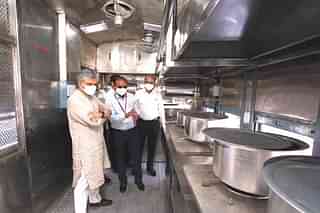 Railway Minister Ashwini Vaishnaw inspects the prototype of the converted pantry car.