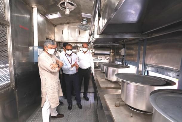 Railway Minister Ashwini Vaishnaw inspects the prototype of the converted pantry car.