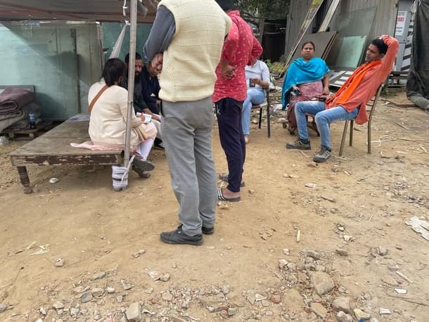 The group sitting at the plot in sector 12A