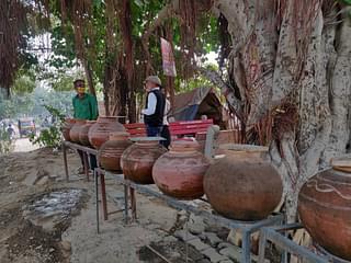 Water pitchers arranged in an array along the site in Sector 10