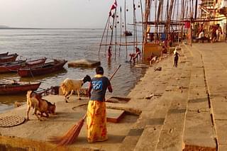 Namami Gange staff ensuring a cleanup of the ghats through the day. Brahma Ghat scenes early morning.