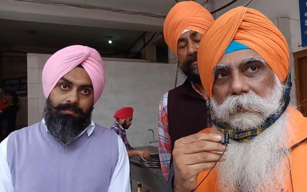 Ravi Ranjan Singh (holding the mike)