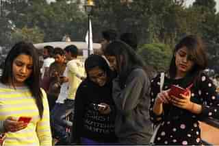 People using free WiFi (Arvind Yadav/Hindustan Times via Getty Images