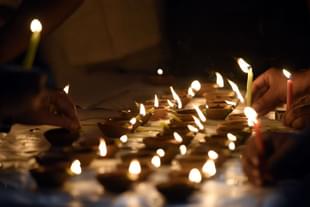 People light diyas on Diwali in New Delhi, India. (Sonu Mehta/Hindustan Times via GettyImages)
