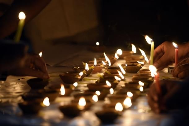 People light diyas on Diwali in New Delhi, India. (Sonu Mehta/Hindustan Times via GettyImages)