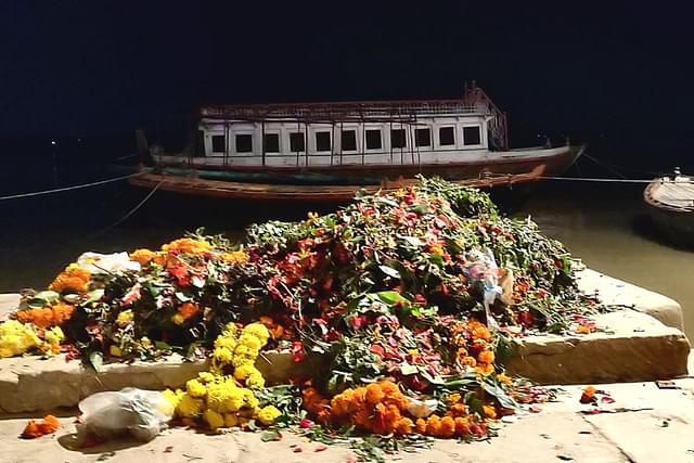 No flowers are dumped into the Ganga, informs the boatman.