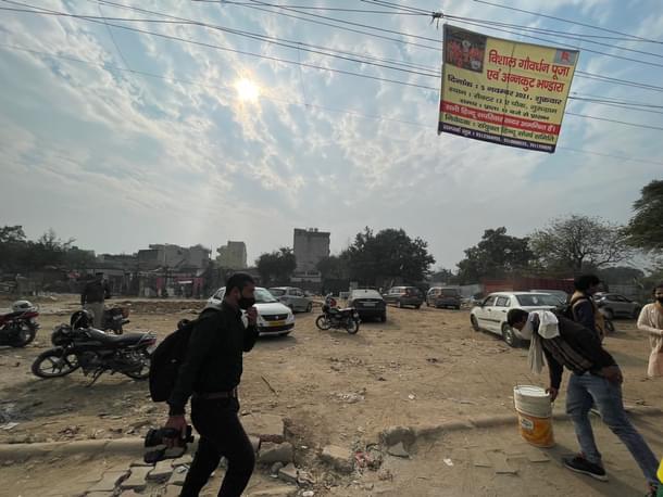 A banner announcing a puja at the plot last week