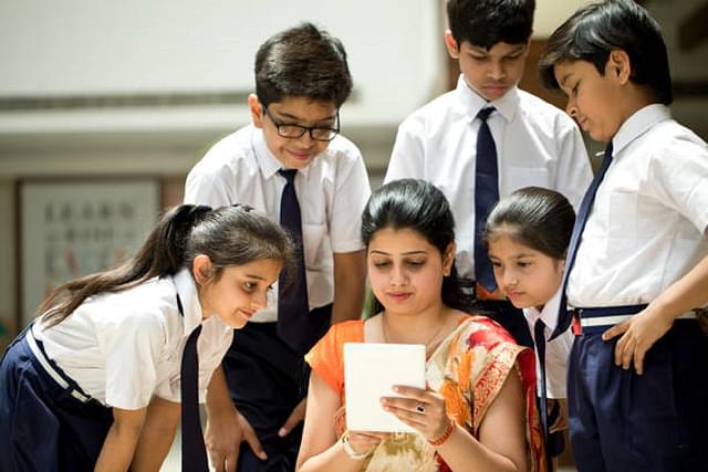 Students with their teacher at a school (Representative image)